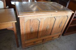 A 1940s oak three panel mule chest, having beaded and moulded decoration, the base with two drawers.