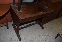 A Victorian mahogany sofa table, having reeded edge over demilune flaps and two drawers, all