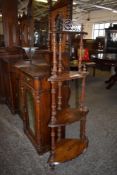 A Victorian inlaid walnut four tier corner whatnot, with fret cut and turned decoration. 145CM.