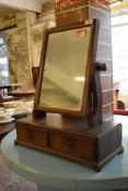 A Victorian mahogany swing dressing mirror, of traditional design with scrolled uprights and two