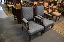 A pair of late Victorian/Edwardian His and Hers Armchairs, the mahogany frame part upholstered in