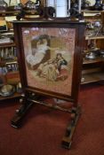 A Victorian rosewood firescreen with scrolled surmount over a tapestry depiction of Charles I and