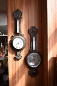 Two early 20th century oak aneroid barometers. 74CM. and 77CM.