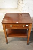 An Edwardian mahogany cabinet, with single drawer over under shelf, raised on tapering inlaid square