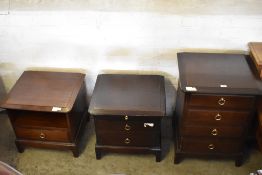 A Stag Minstrel four drawer bedside chest together with two smaller Stag bedside tables.