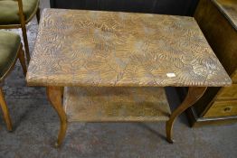 An imported carved wood two tier occasional table, profusely carved throughout with flowers. 68CM.