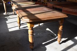 A Victorian mahogany extending dining table of canted rectangular form with moulded edge detail over