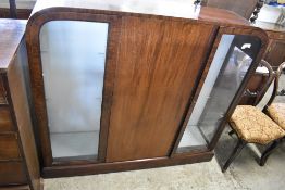 A 1930s mahogany side-by-side glazed display cabinet. 124CM. X. 133CM.