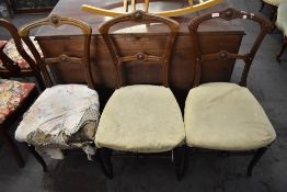 A group of three late Victorian single chairs, with moulded and carved decoration. Seat height.