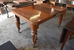 Victorian mahogany extending dining table of rounded rectangular form with moulded edge detail,