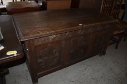 An 18th century oak three panel coffer, of rectangular form with moulded edge decoration and later