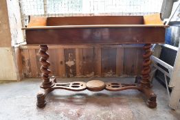 A Victorian mahogany washstand with three quarter gallery over two blind drawers, raised on barley