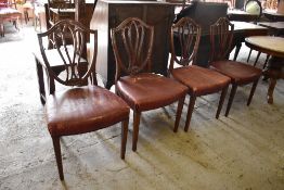 A set of four 19th century design mahogany dining chairs, with moulded shield backs, bow fronted