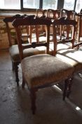 A set of six late Victorian mahogany dining chairs with carved and incised decoration. Seat