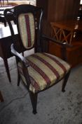 And Edwardian stained mahogany armchair, with Art Nouveau influenced design. Seat height. 47CM.