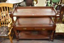 A Victorian stained mahogany three tier buffet, the central tier with two drawers 112CM. X. 115CM.
