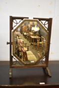 A Small Edwardian mahogany swing dressing mirror. The canted rectangular plate within a square