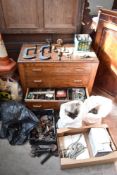 A 1940s oak chest of three drawers containing a variety of tools and fixtures, and a selection of
