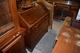 A 19th century banded mahogany bureau of traditional design with brass bale handles. 109CM. X111CM.