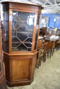 An Edwardian astragal glazed mahogany double corner cupboard, retailed by Sopwith and Co limited,