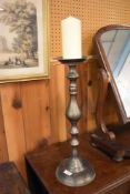A cast metal pricket candlestick, of traditional turned design. 51CM.