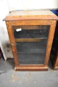 A late Victorian inlaid mahogany music cabinet, the glazed door with foliate inlaid spandrels.
