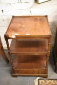 A reproduction mahogany three tier whatnot