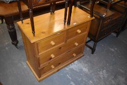 A modern pine 2/2 chest of drawers. 77 CMX. 91CM.