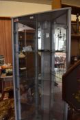 A modern silvered effect glass fronted corner display unit, with mirrored interior. 172CM.
