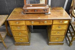 An Edwardian banded mahogany pedestal desk of traditional design