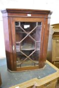 A small Edwardian mahogany astragal glazed corner cupboard. 75CM.