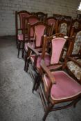A set of six Edwardian inlaid mahogany dining chairs, comprising two carvers and four singles,