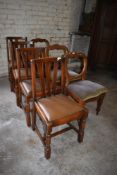 A group of three Victorian mahogany balloon back dining chairs sold together with a set of four