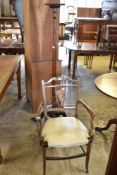 An Edwardian inlaid mahogany armchair, having slender square section rails and central inlaid and