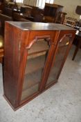 Victorian mahogany bookcase with two arched glazed doors 102cm Lacking surmount. One glass panel