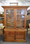 A Colonial teak glazed bookcase, most likely Indian, of traditional design 209CM.