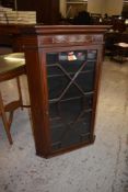 A Georgian inlaid mahogany and astragal glazed corner cupboard, with canted ends. 110cm