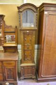 An early 20th century oak long case clock case, with Jacobean style geometric moulding. 223CM.