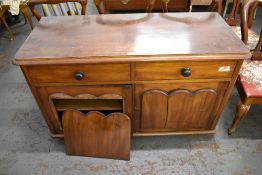 A Victorian mahogany two drawer and two door cupboard. (AF) 74CM.