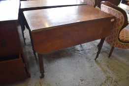 A Victorian Mahogany Pembroke table of traditional design with turned and reeded legs, finishing