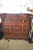 A Victorian figured mahogany chest of drawers, the serpentine top over a blind frieze drawer and