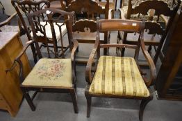 A Regency mahogany carver chair, with typical scrolled arms and sabre legs, each with reeded