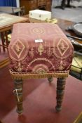 A 19th century mahogany stool, of rectangular form with turned legs. 55CM.