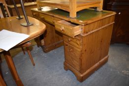 A modern Ducal pine twin pedestal desk, of traditional design with green tool leather skiver.