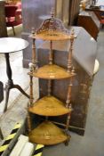 A Victorian inlaid mahogany four tier corner whatnot, with turned and spirally fluted supports