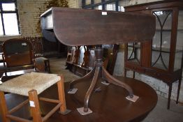 A 19th century mahogany pedestal Pembroke table of smaller than normal proportions. with turned