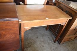 A Reproduction mahogany side table of rectangular form, the moulded square legs with sunburst