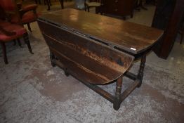 A 19th century dropleaf gate leg table, of traditional design with baluster turned upright and plain