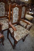 A set of six Old Charm upholstered oak dining chairs, bearing label to underside and comprising