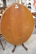 A Victorian Mahogany oval Loo table, of traditional design, with five turned supporting columns